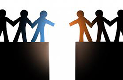 Two paper people chains on two cliffs, unable to reach across to each other - representing the current political divide